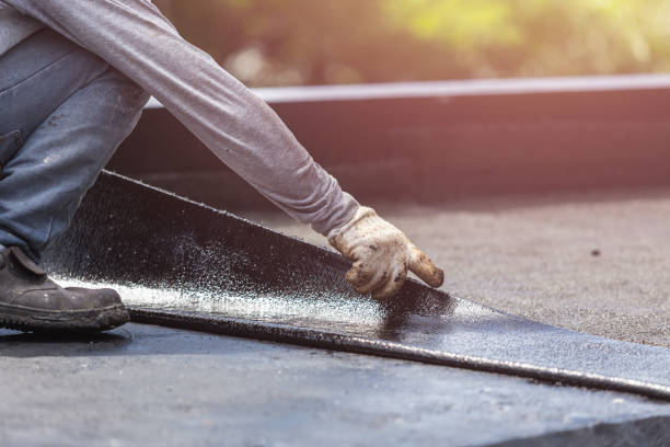 Professional Basement Waterproofing technician working in Rossville, GA